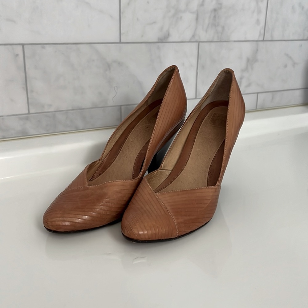 These are Frye high heals, they are light brown with a black heal